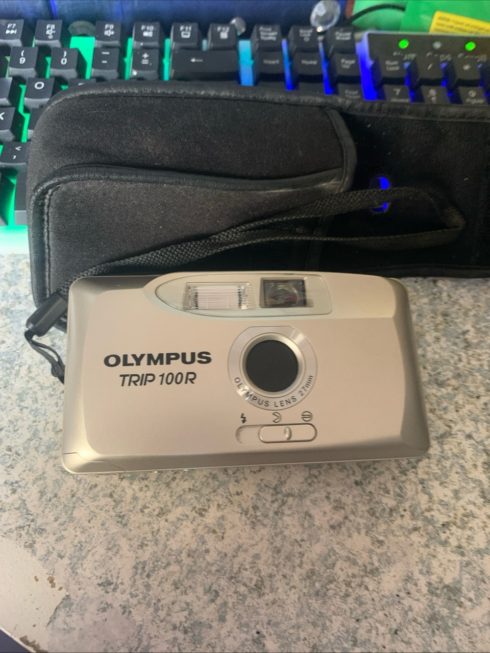Vintage Olympus trip 100r silver compact point-and-shoot camera with black case
